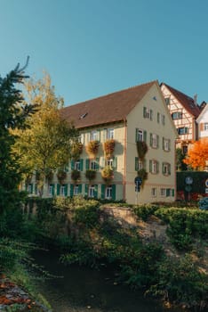 Old national German town house. Old Town is full of colorful and well preserved buildings. Baden-Wurttemberg is a state in southwest Germany bordering France and Switzerland. The Black Forest, known for its evergreen scenery and traditional villages, lies in the mountainous southwest. Stuttgart, the capital, is home to Wilhelma, a royal estate turned zoo and gardens. Porsche and Mercedes-Benz have headquarters and museums there. The 19th-century Hohenzollern Castle sits in the Swabian Alps to the south.