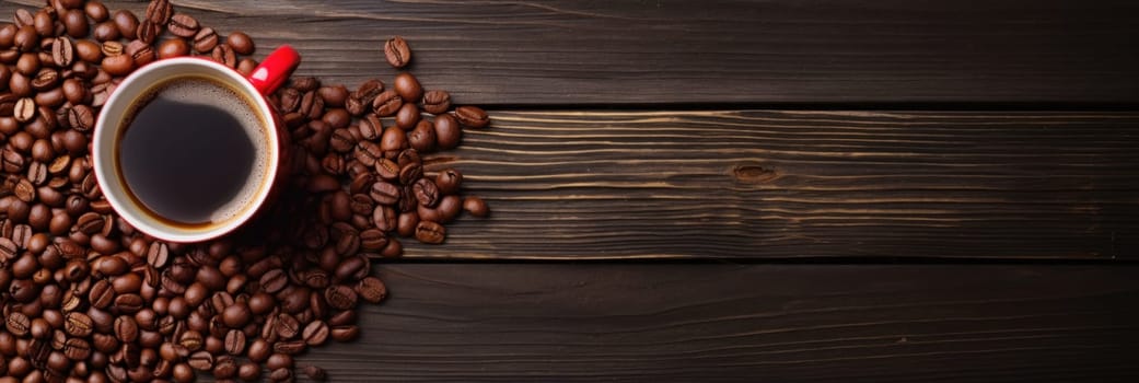 A cup of coffee is surrounded by roasted beans on a wooden table