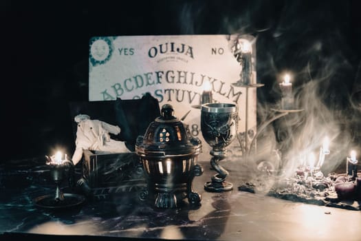 A worn rag doll lies in a haunting occult setting with a Ouija board backdrop, invoking a sense of mystery