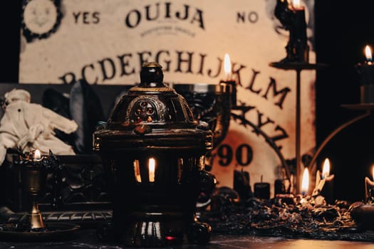 A worn rag doll lies in a haunting occult setting with a Ouija board backdrop, invoking a sense of mystery