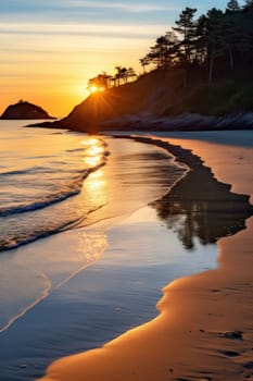 A beach with a sunset and the ocean in front of it