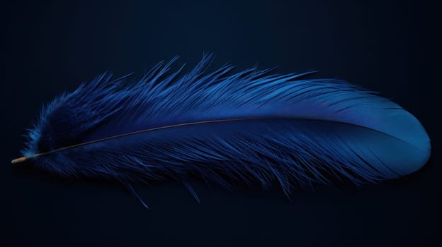 A blue feather laying on a black background with no other objects