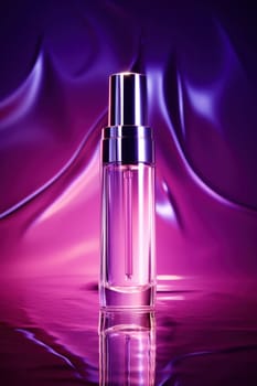 A bottle of perfume sitting on a purple background