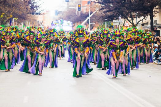 Badajoz, Spain, sunday. February 13 2024. Carnival parade through the streets of Badajoz