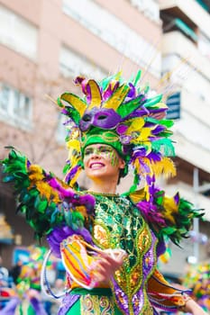 Badajoz, Spain, sunday. February 13 2024. Carnival parade through the streets of Badajoz