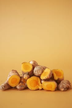 detail shot of turmeric root in bowl on table