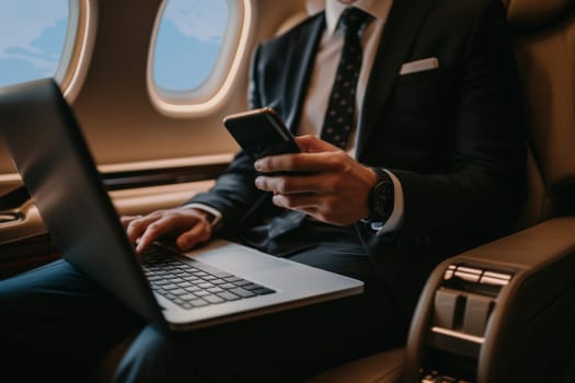 Working on airplane, businessman sitting and using smartphone inside airplane near the window.