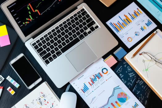 modern office workspace with a laptop displaying graphs and document, Working desk table concept.
