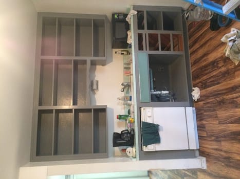 Painting the Kitchen Cabinets, Kitchen Remodel of 1960s Home. High quality photo