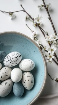 A bowl of eggs and flowers on a table next to each other