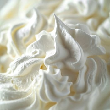 A close up of whipped cream on a plate with some white stuff