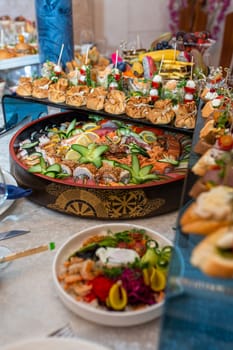 An opulent buffet showcasing a lavish assortment of fresh seafood, sushi, salads, fruits, and pastries, beautifully arranged on a pristine white tablecloth for a luxurious and celebratory event.