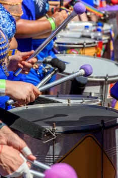 Drums played by women during a street carnival performance in the city of Belo Horizonte, Minas Gerais