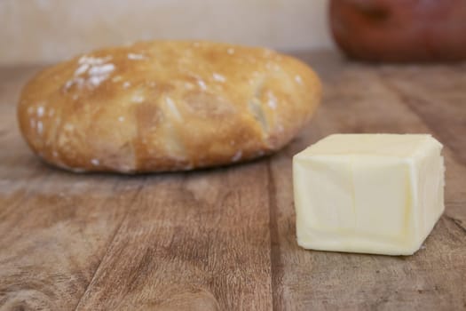 homemade bread loaf and a piece of butter