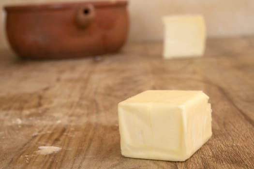 a piece of butter on a wooden table