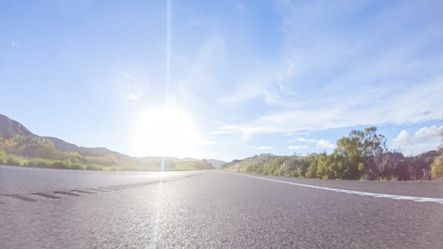 Basking in the beauty of a sunny winter day, driving on HWY 1 near Las Cruces, California offers stunning views of the picturesque coastal landscape against a backdrop of clear blue skies.