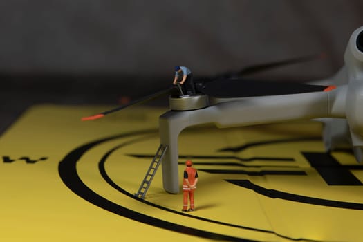 man checking the working of the propeller of a drone