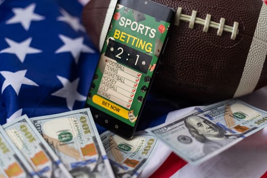 rugby ball and dollars with usa flag and smartphone bet. High quality photo