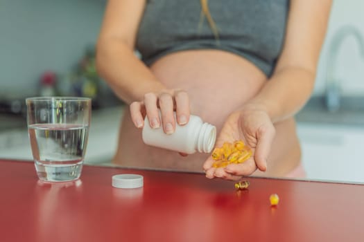 pregnant woman conscientiously takes fish oil capsules, rich in omega-3, prioritizing essential nutrients for a healthy pregnancy journey.