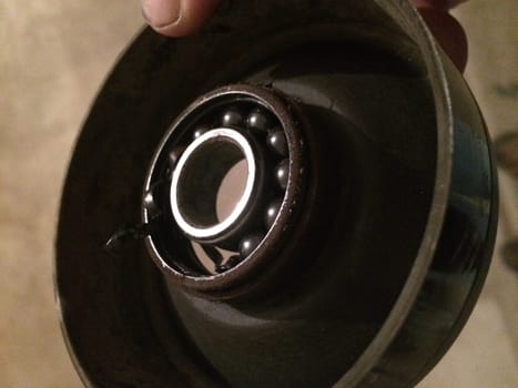 Broken Pulley For Car Belt, Missing Ball Bearings. High quality photo