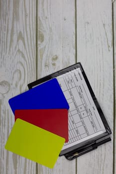 Set of football referee with notepad and blue card, changes in football rules, blue card concept in football