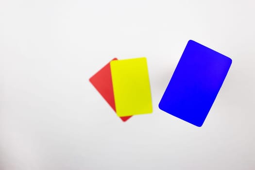 New blue card for referee set on background of red and yellow cards on a white background, concept of blue card in football for temporarily sending off player