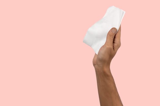 Black male hand holding a cleaning cloth isolated. Cleaning concept. High quality photo