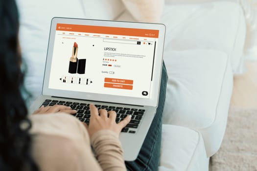 Woman shopping online on internet marketplace browsing for sale items for modern lifestyle and use credit card for online payment from wallet protected by crucial cyber security software