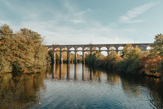 Railway Bridge with river in Bietigheim-Bissingen, Germany. Autumn. Railway viaduct over the Enz River, built in 1853 by Karl von Etzel on a sunny summer day. Bietigheim-Bissingen, Germany. Old viaduct in Bietigheim reflected in the river. Baden-Wurttemberg, Germany. Train passing a train bridge on a cloudy day in Germany