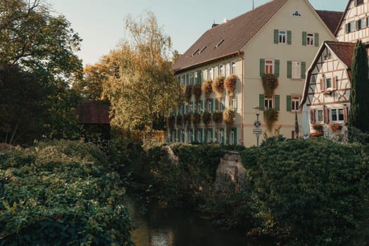 Old national German town house. Old Town is full of colorful and well preserved buildings. Baden-Wurttemberg is a state in southwest Germany bordering France and Switzerland. The Black Forest, known for its evergreen scenery and traditional villages, lies in the mountainous southwest. Stuttgart, the capital, is home to Wilhelma, a royal estate turned zoo and gardens. Porsche and Mercedes-Benz have headquarters and museums there. The 19th-century Hohenzollern Castle sits in the Swabian Alps to the south.