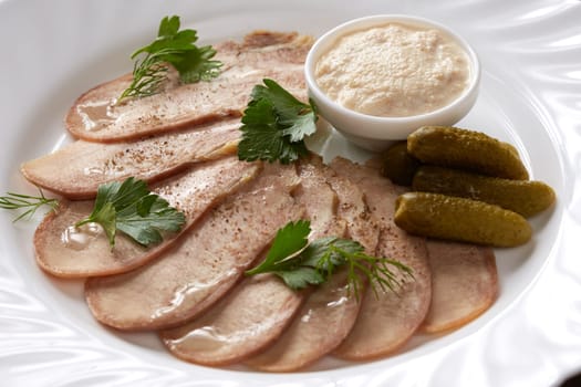 Cold meats, pickles and sauce, close-up. Restaurant food