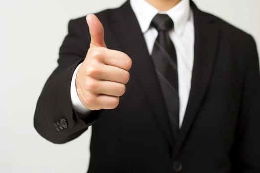 A man in a suit giving a thumbs up, created with Generative Ai.