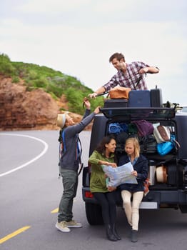 Friends, road trip and map or car travel with luggage on roof on mountain path for vacation, adventure or location. People, group and together in Italy with transportation or camping, holiday or bags.