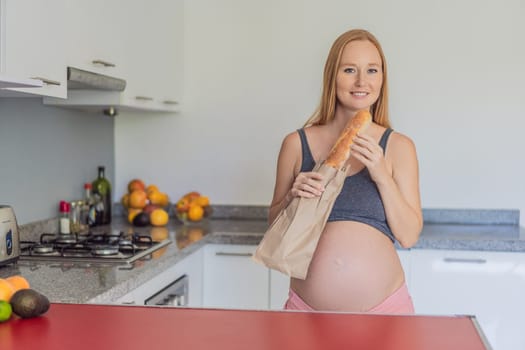 Pregnant woman eating bread in the kitchen. Exploring the impact of gluten during pregnancy: understanding the potential benefits and risks for maternal health and fetal development.