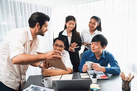 Group of diverse office worker employee working together on strategic business marketing planning in corporate office room. Positive teamwork in business workplace concept. Prudent