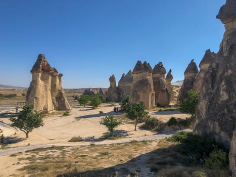 Aerial drone shot of the Fairy Chimneys over the landscape of Goreme, Cappadocia. High quality photo