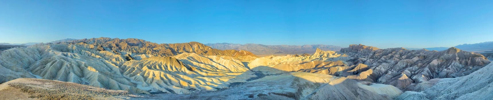 Death Valley Zabriskie Point huge view panorama on sunset sky background