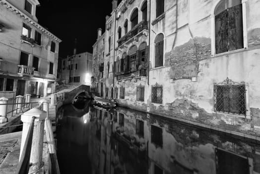 venice canals night view with light reflections in black and white