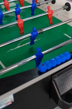 Board game football, an active and developing game for motor skills, attentiveness and dexterity for children, a team game.