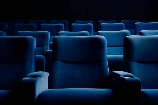 Empty blue seats in cinema, domestic intimacy, zoom in, up close. Neural network generated in January 2024. Not based on any actual scene or pattern.