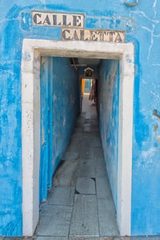 colorful walls of Burano Venice on sunny day: Calle Caletta