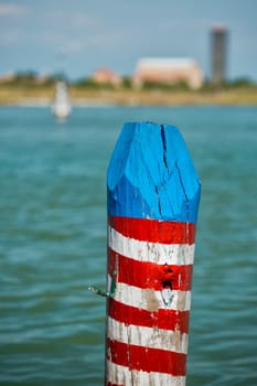 Venice laguna mooring pole red blue and white