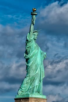 Statue Of Liberty - Manhattan - Liberty Island - New York on cloudy deep blue sky