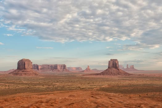 Monument Valley aerial view on cloudy sky and lights on mittens