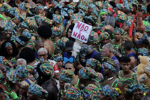 salvador, bahia, brazil - february 10, 2024: members of the caranval group As Muquiranas are seen during the carnival in the city of Salvador.