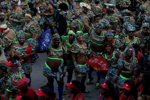 salvador, bahia, brazil - february 10, 2024: members of the caranval group As Muquiranas are seen during the carnival in the city of Salvador.