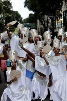 salvador, bahia, brazil - february 10, 2024: members of the Afoxer Filhos do Korin Ofano block seen during the caranval in the city of Salvador.