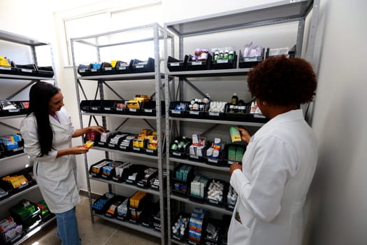 ilheus, bahia, brazil - december 11, 2023: professionals are seen in a pharmacy of a public health unit in the city of Ilheus