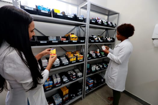 ilheus, bahia, brazil - december 11, 2023: professionals are seen in a pharmacy of a public health unit in the city of Ilheus