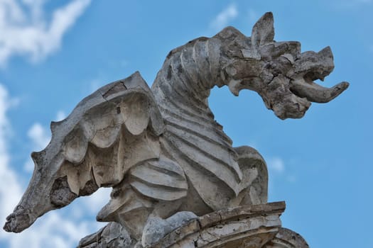 stone dragon statue on the blue sky background